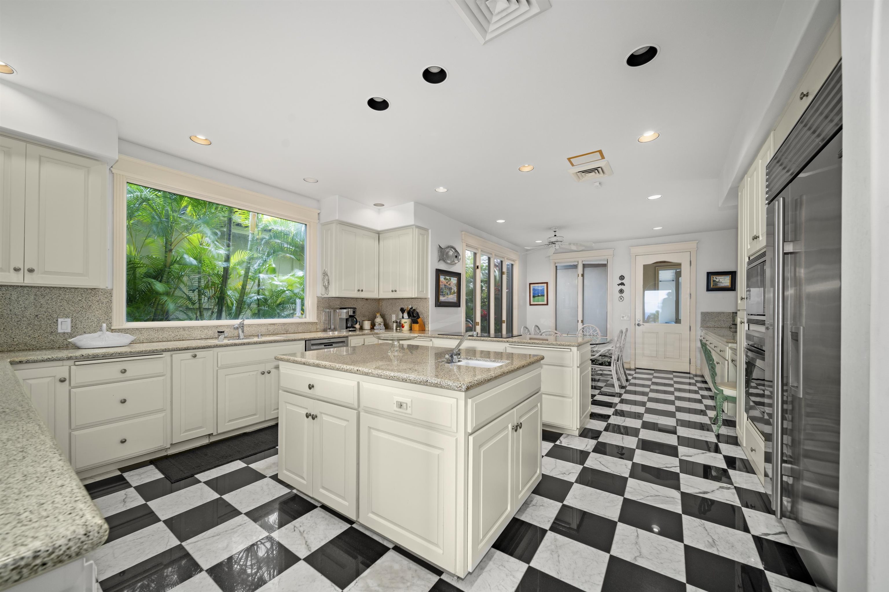 212 Crestview Road Lahaina, HI 96761 - Photo 20 of 50 a kitchen with a stove a sink and a refrigerator