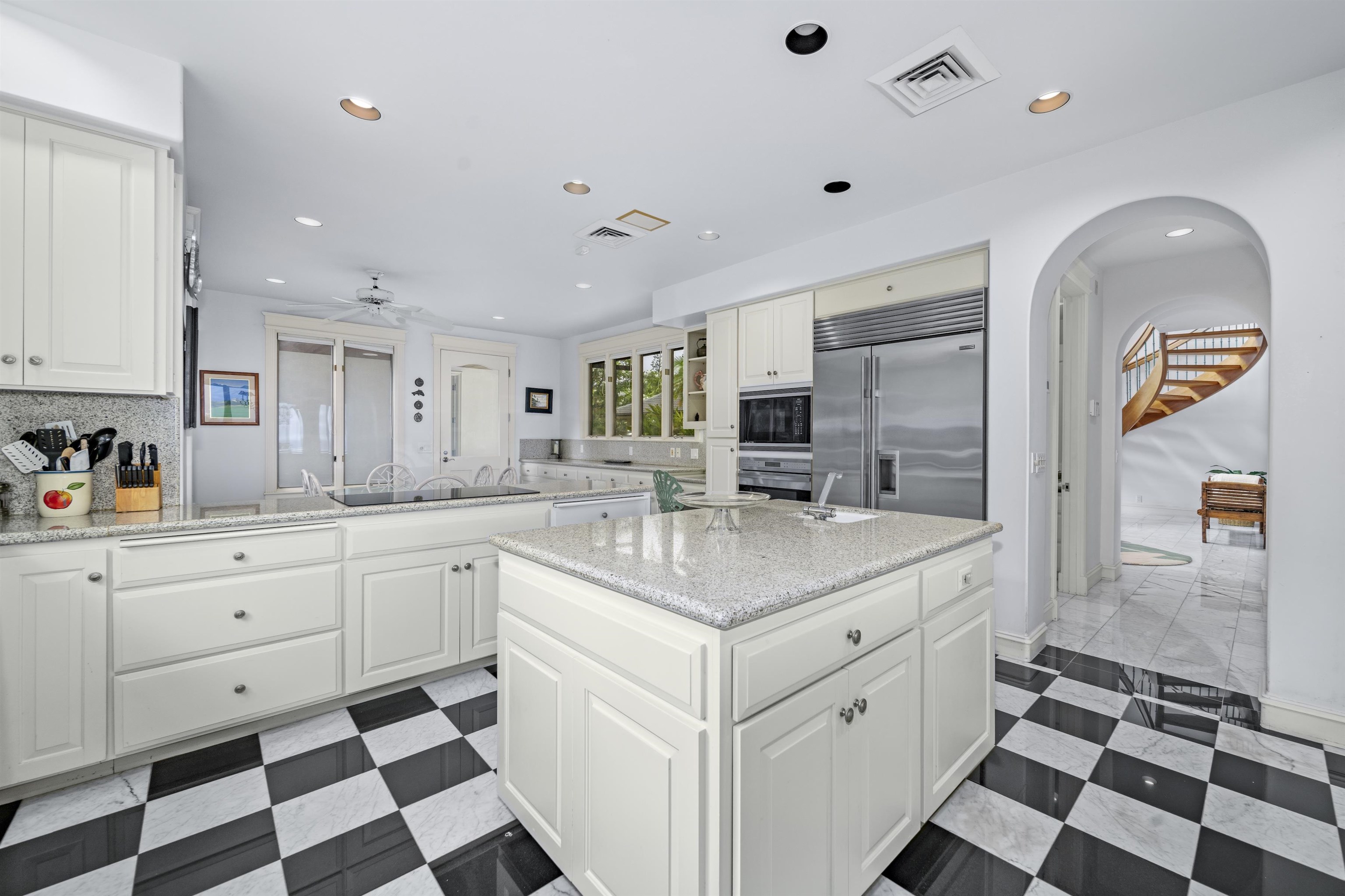 212 Crestview Road Lahaina, HI 96761 - Photo 21 of 50 a kitchen with a sink a stove and cabinets