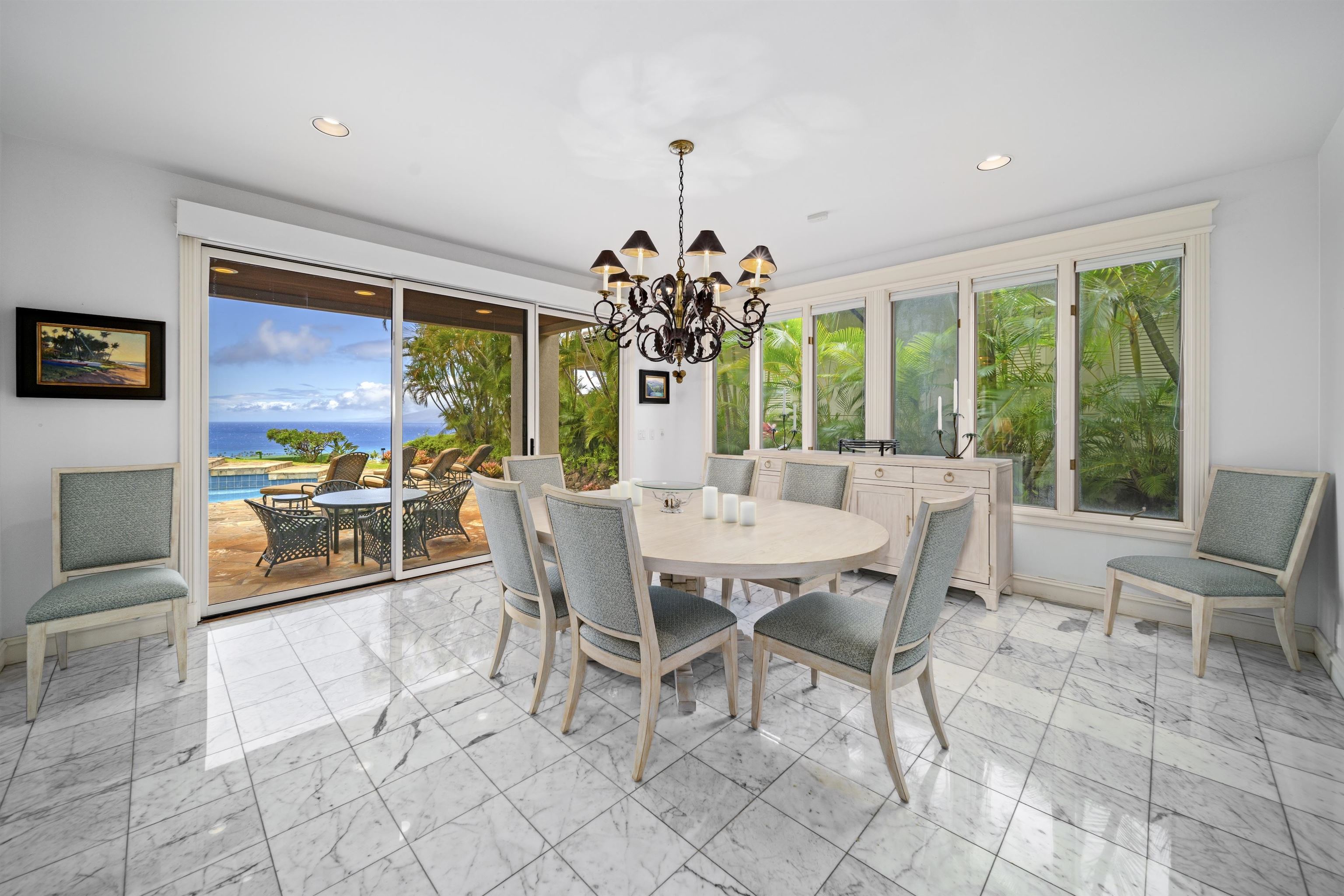 212 Crestview Road Lahaina, HI 96761 - Photo 22 of 50 a dining room with furniture a chandelier and a rug
