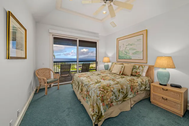 a bedroom with a bed chair and wall painting