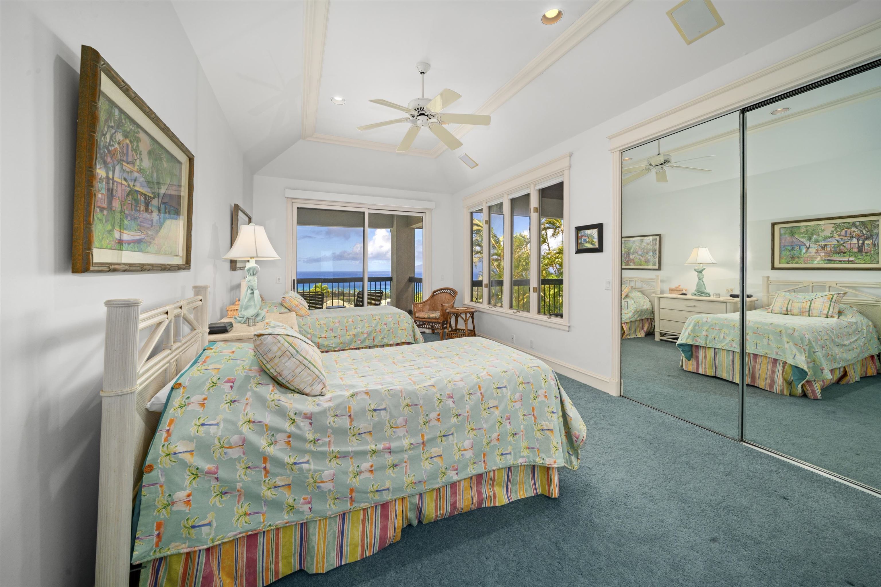 212 Crestview Road Lahaina, HI 96761 - Photo 42 of 50 a spacious bedroom with a bed and wooden floor