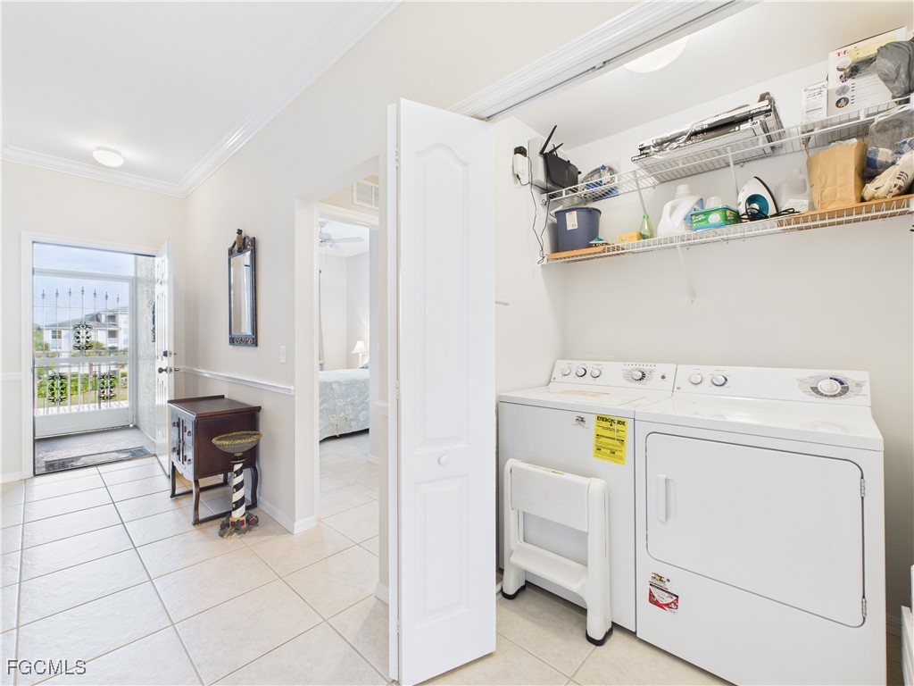 10461 Washingtonia Palm Way, Unit 3436 Fort Myers, FL 33966 - Photo 17 of 32 a utility room with dryer and washer
