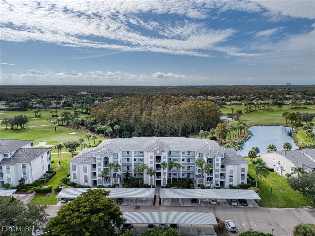 10461 Washingtonia Palm Way, Unit 3436 Fort Myers, FL 33966 - Photo 26 of 32 an aerial view of a house with a garden