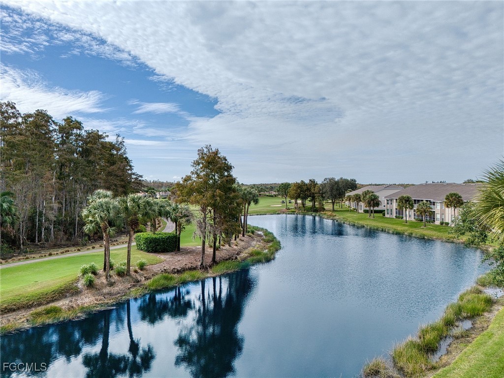 10461 Washingtonia Palm Way, Unit 3436 Fort Myers, FL 33966 - Photo 30 of 32 a view of a lake with outdoor space