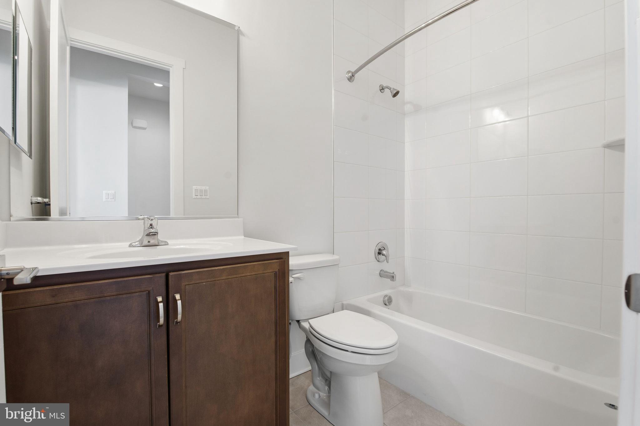 124 Bridge Valley Road, Unit 26 Gettysburg, PA 17325 - Photo 21 of 29 a bathroom with a sink a toilet and shower