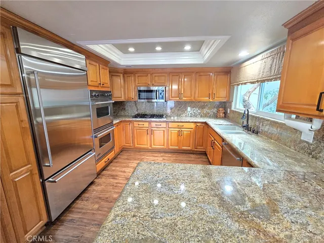 a view of a kitchen with a sink and dishwasher