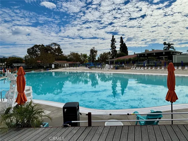 a patio with water fountain and outdoor seating