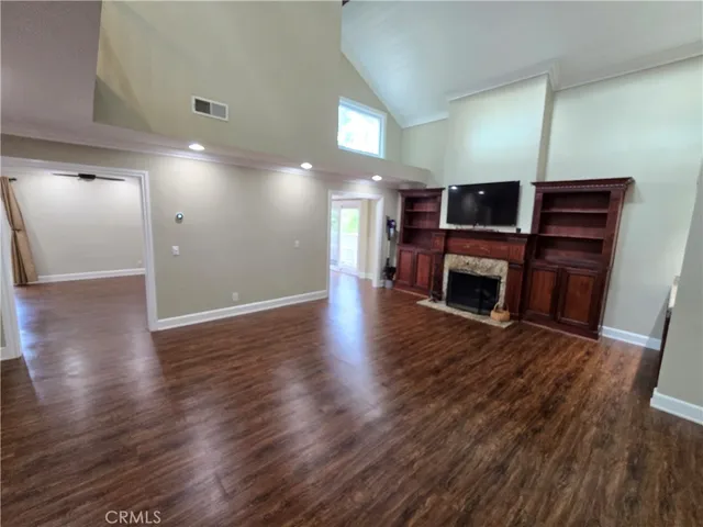 a view of a livingroom with furniture and wooden floor