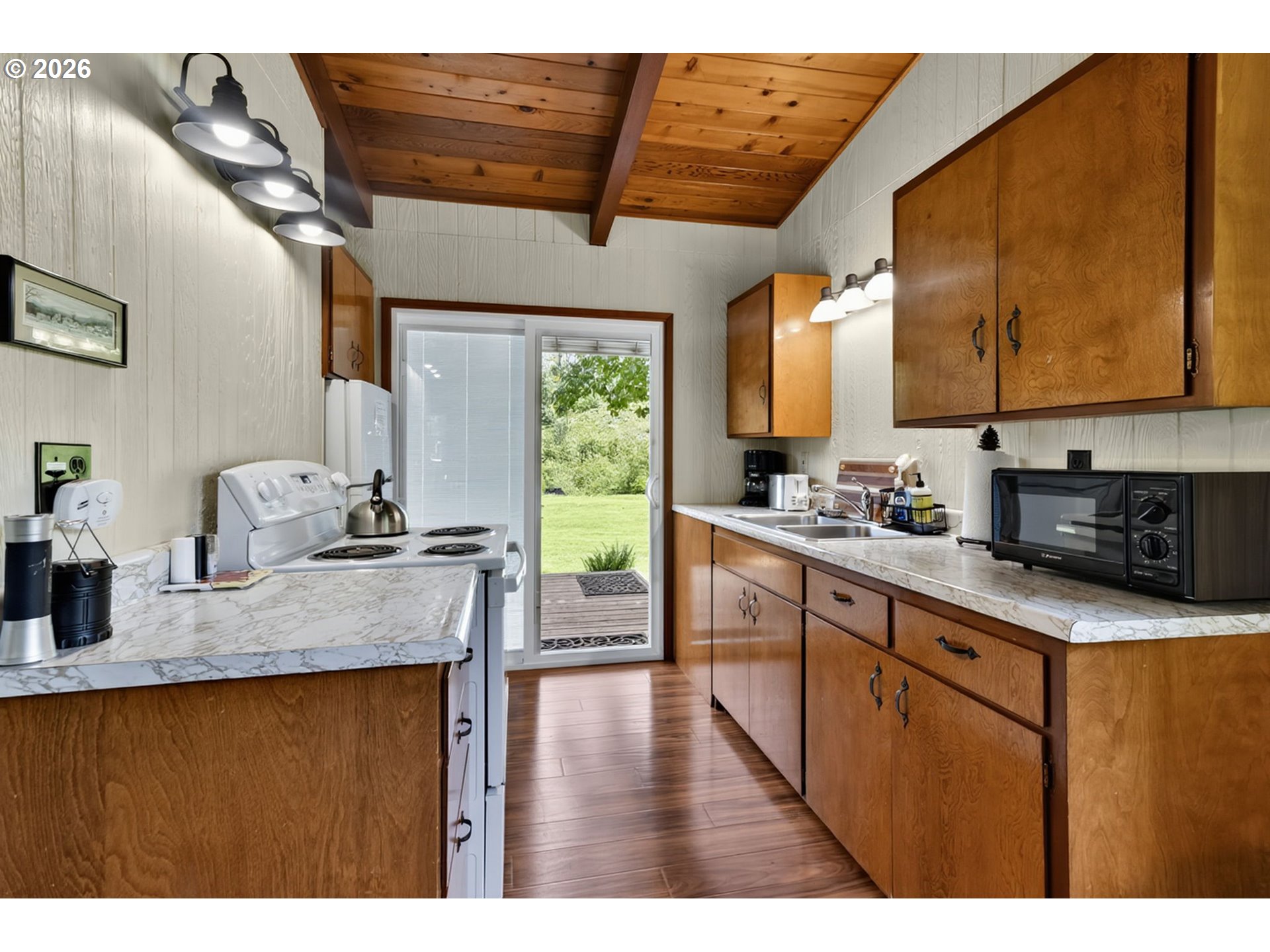 46725 Goodpasture Road Vida, OR 97488 - Photo 24 of 48 a kitchen with stainless steel appliances granite countertop a sink dishwasher stove and refrigerator