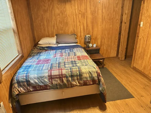 a living room with a couch and wooden floor