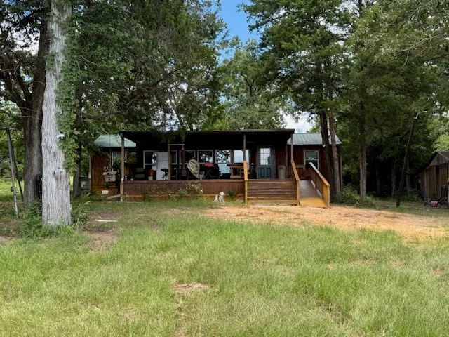 a view of a swimming pool with a table and chairs