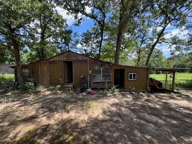 a view of a barn in the middle of house