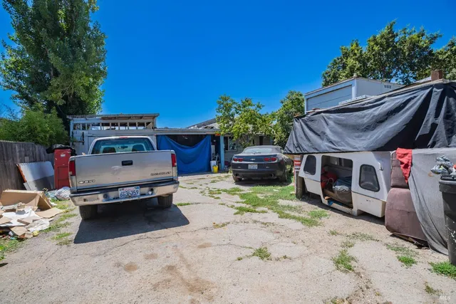 a view of a backyard with a sitting area and furniture