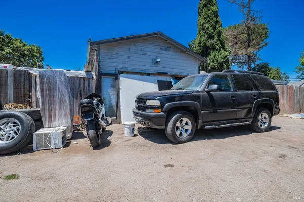a view of a car in front of a house