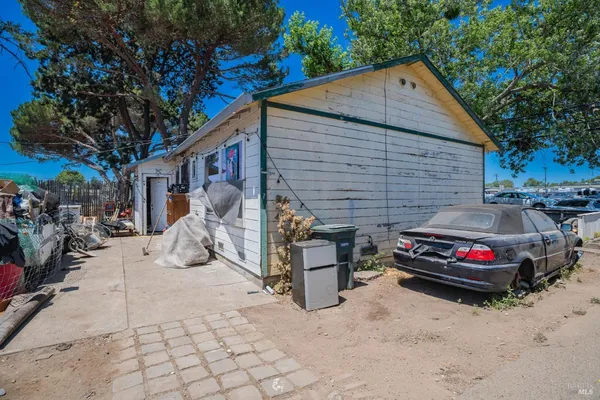 a front view of a house with parking space