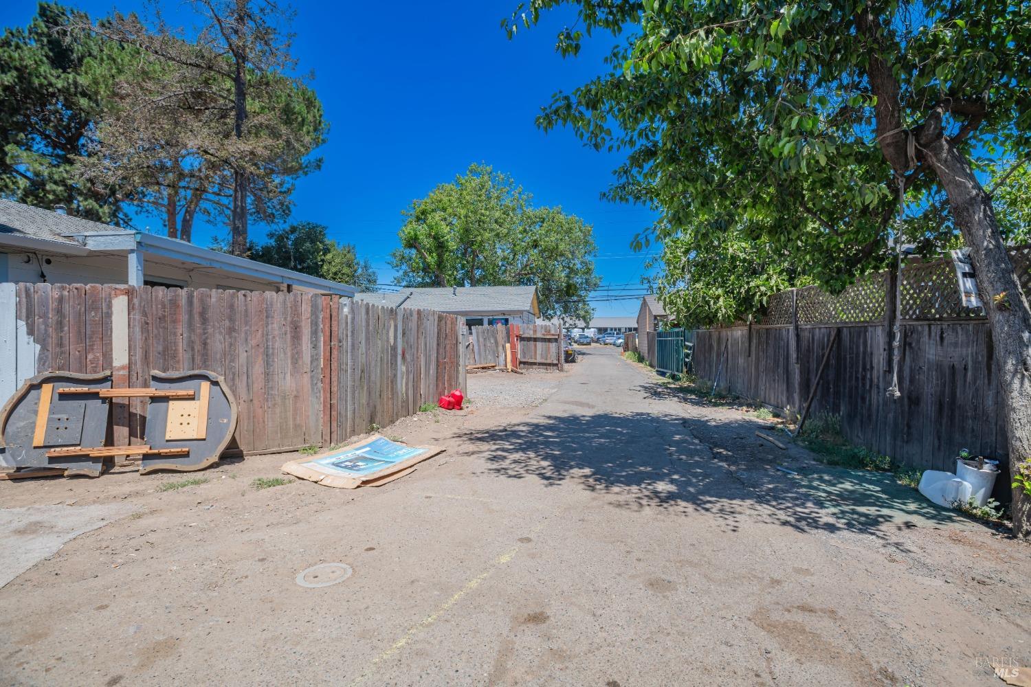 104 Bellevue Avenue Santa Rosa, CA 95407 - Photo 9 of 20 a view of backyard with small cabin and wooden fence