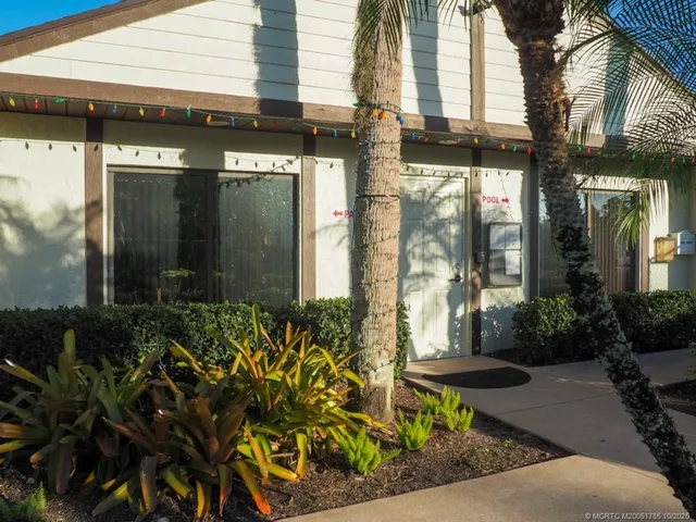 a view of a chairs in a backyard