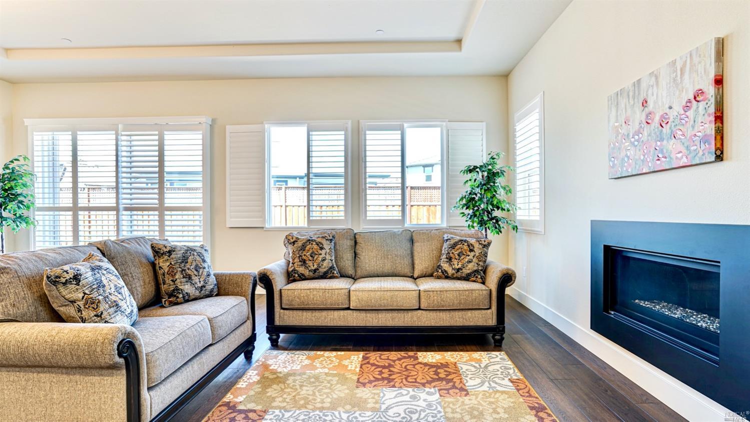 3935 Millbrook Drive Santa Rosa, CA 95404 - Photo 1 of 1 a living room with furniture and a fireplace