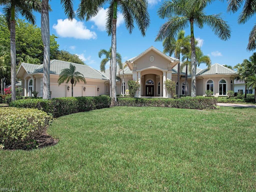 1633 China Berry Way Naples, FL 34105 - Photo 1 of 1 a front view of a house with a garden