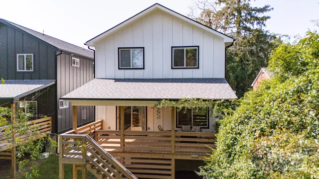 a aerial view of a house with table and chairs