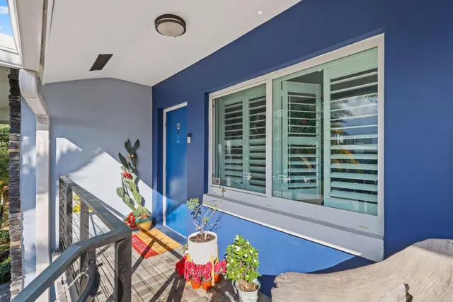 a kitchen with stainless steel appliances granite countertop a refrigerator a stove a sink and a refrigerator with wooden floor