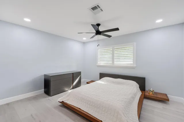a kitchen with kitchen island a sink stove and refrigerator