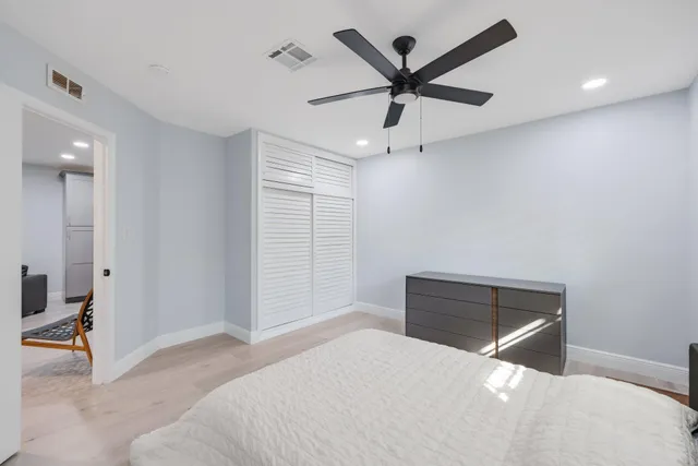 a kitchen with cabinets stainless steel appliances and a sink