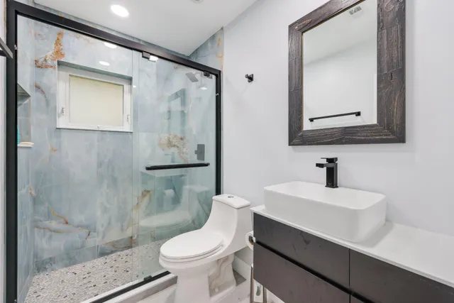 a kitchen with cabinets stainless steel appliances and a sink