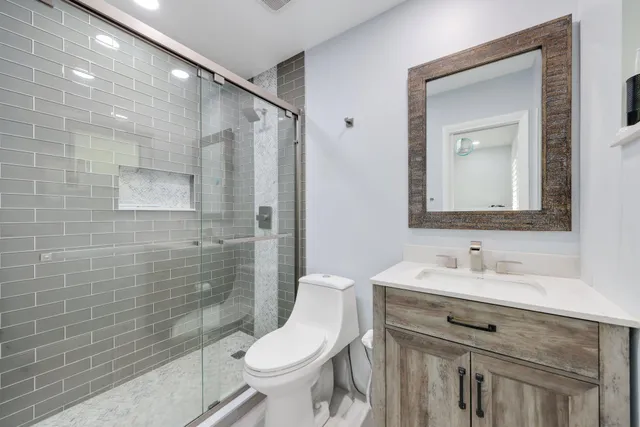 a view of front door with balcony and furniture