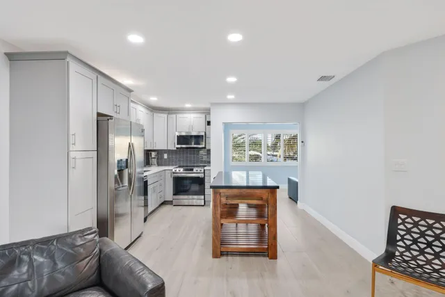 a view of a lake with sitting area