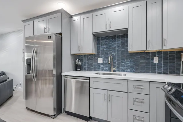 a view of a house with swimming pool and sitting area