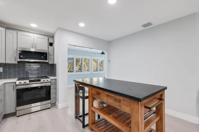 a view of a park with palm trees