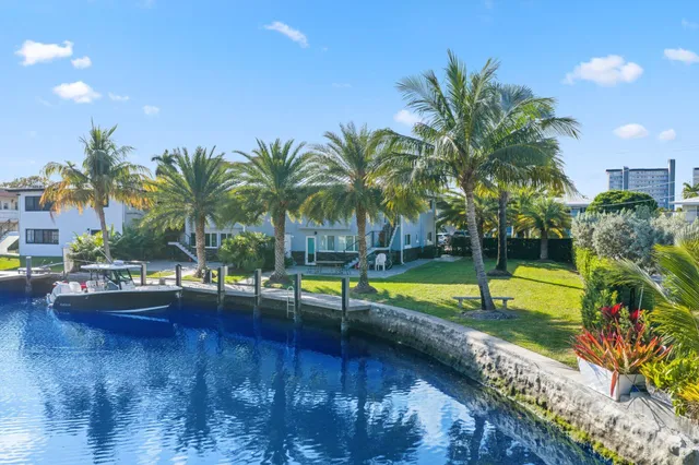 an aerial view of a house with a swimming pool yard and outdoor seating