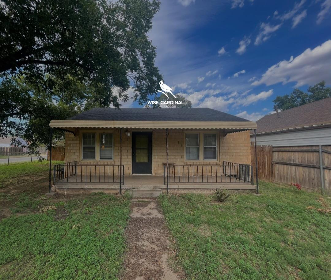 1726 25th Street Lubbock, TX 79411 - Photo 1 of 11 a front view of a house with garden