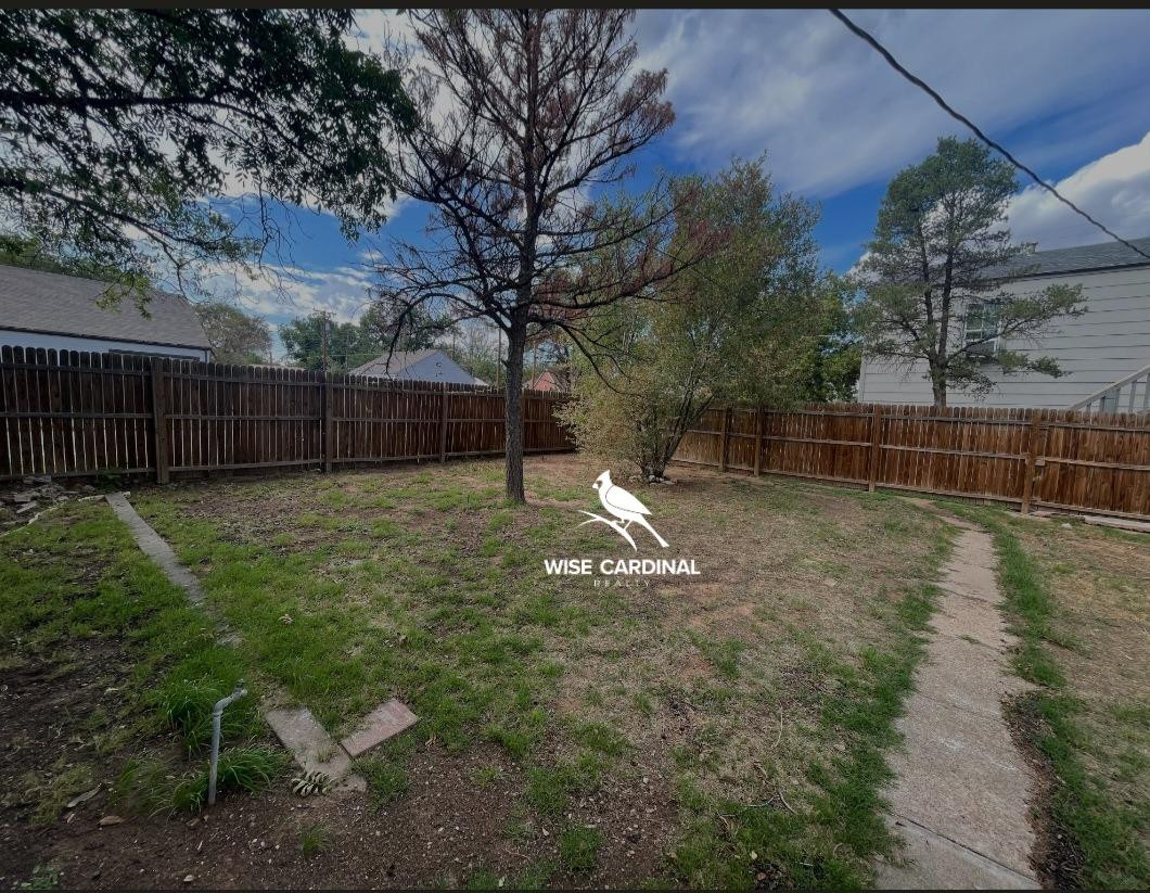 1726 25th Street Lubbock, TX 79411 - Photo 11 of 11 a view of a backyard with a fence