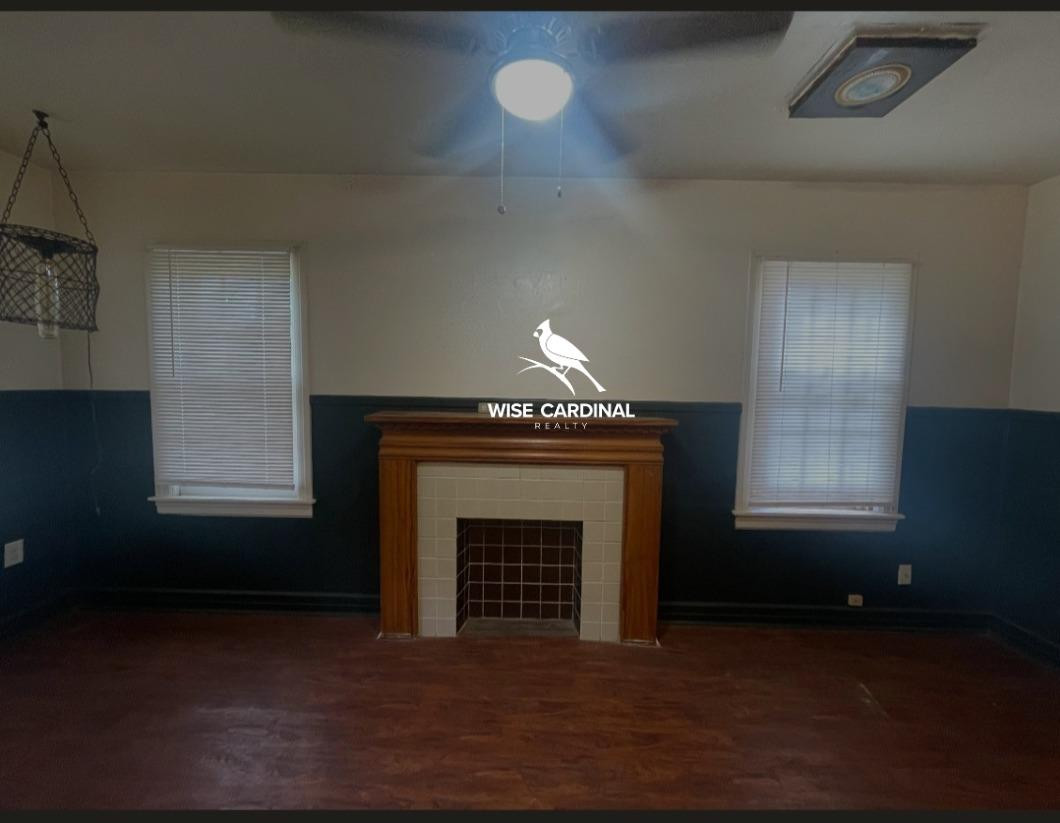 1726 25th Street Lubbock, TX 79411 - Photo 2 of 11 a living room with a fireplace