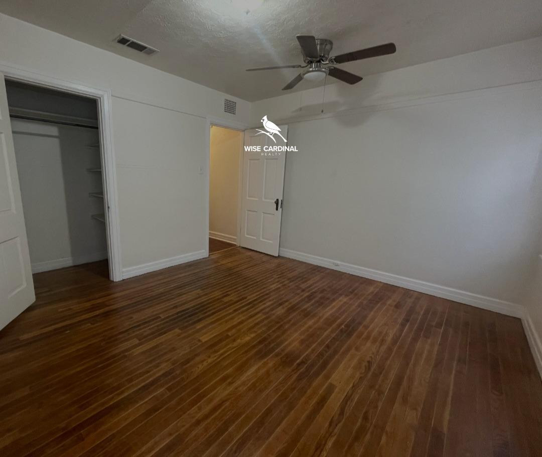 1726 25th Street Lubbock, TX 79411 - Photo 10 of 11 wooden floor in an empty room