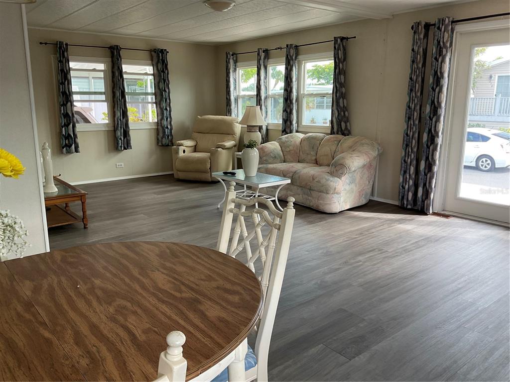 217 Mantua Drive Venice, FL 34285 - Photo 3 of 23 a living room with furniture and a large window