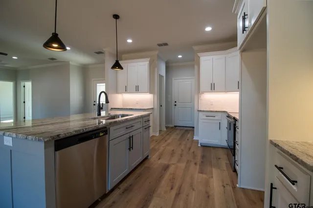 a bathroom with a shower and a sink