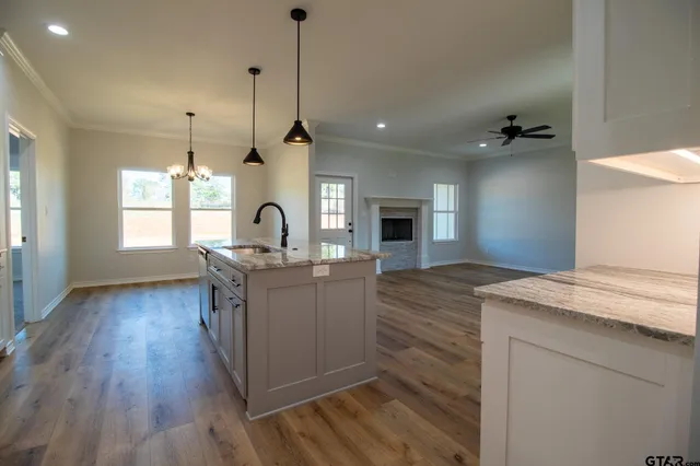 a spacious bathroom with a double vanity sink a mirror and a