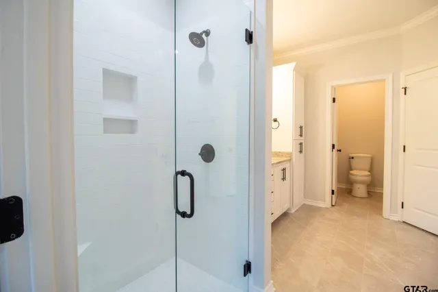 a view of an empty room and a window