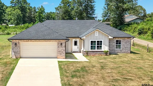a front view of a house with yard