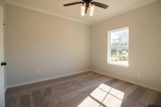 an aerial view of a house with swimming pool and ocean view