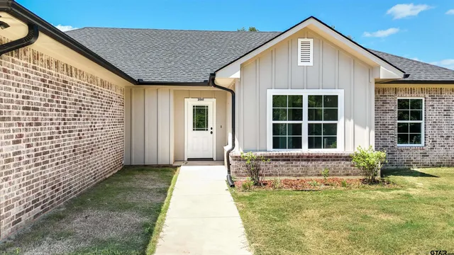 front view of a house with a large window