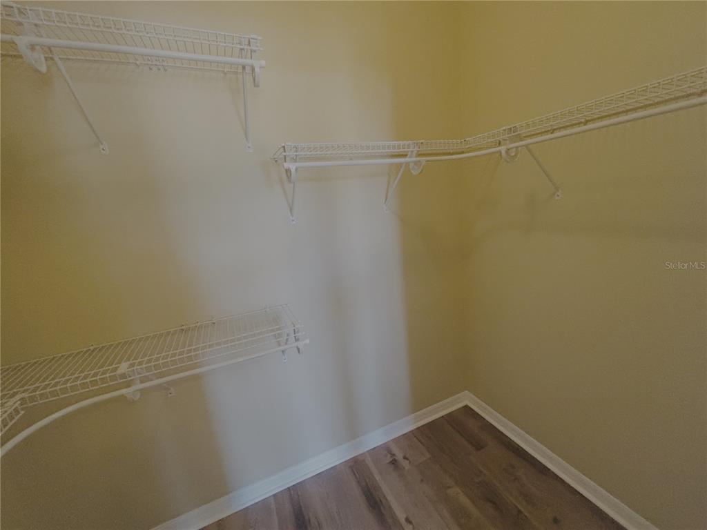 4940 Southwest 63rd Loop Ocala, FL 34474 - Photo 23 of 45 a view of a room with racks on the wall