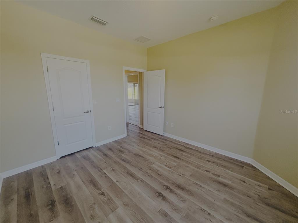 4940 Southwest 63rd Loop Ocala, FL 34474 - Photo 25 of 45 a view of room with wooden floor