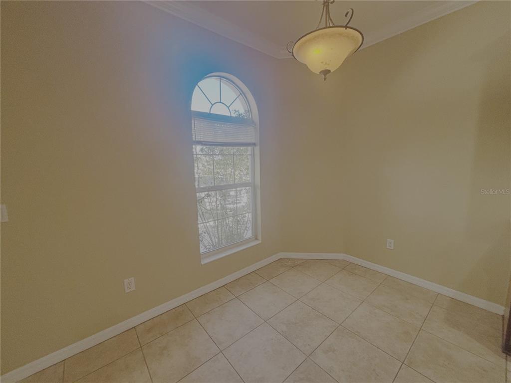 4940 Southwest 63rd Loop Ocala, FL 34474 - Photo 33 of 45 an empty room with a window
