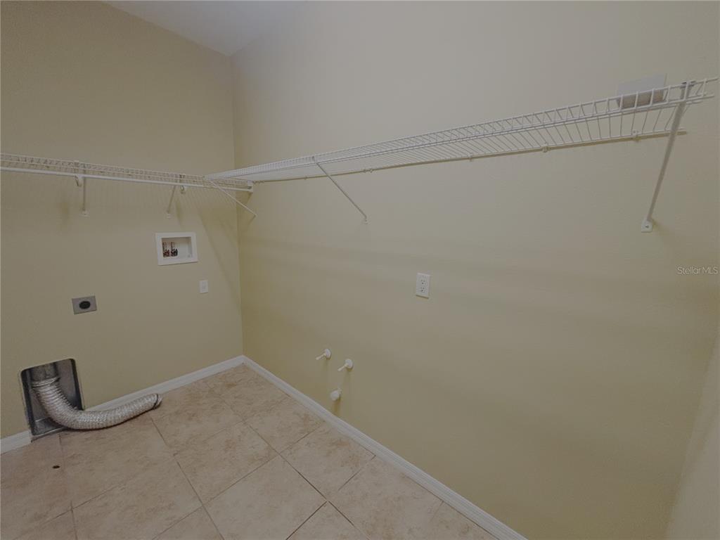 4940 Southwest 63rd Loop Ocala, FL 34474 - Photo 36 of 45 a view of a room with racks on the wall