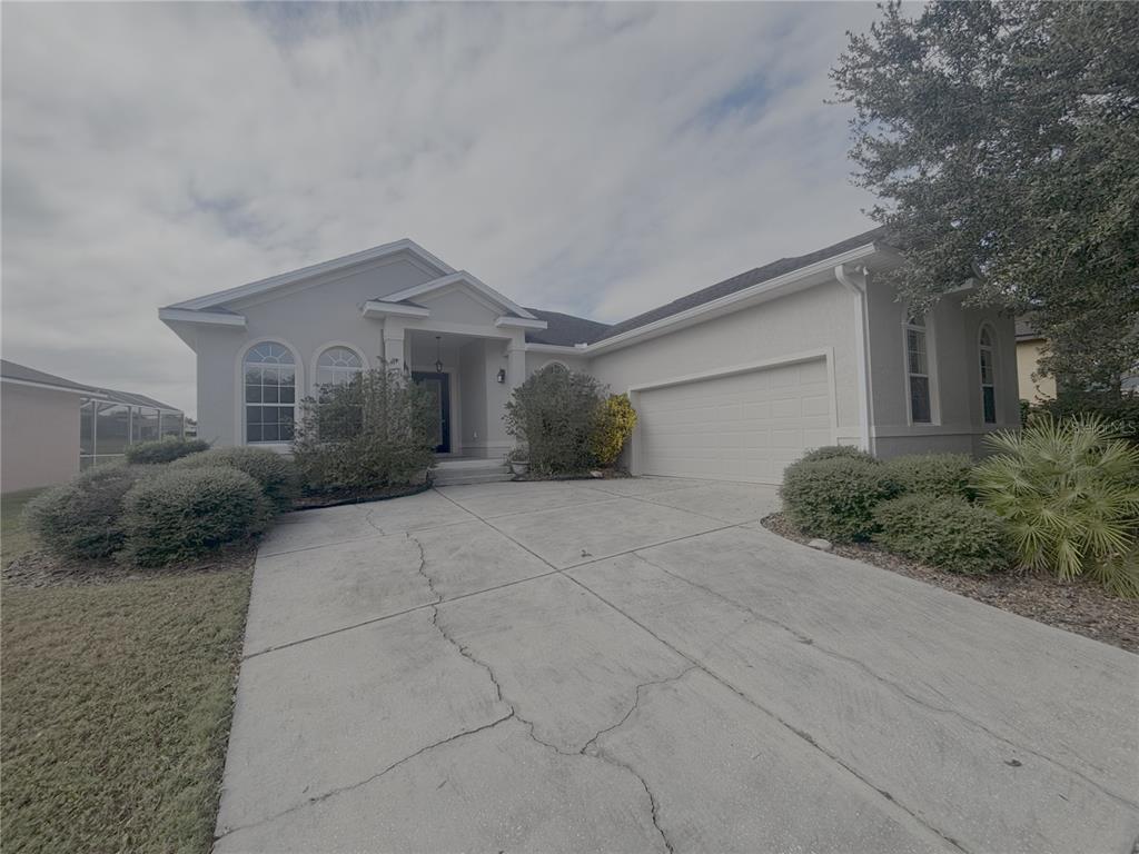 4940 Southwest 63rd Loop Ocala, FL 34474 - Photo 4 of 45 a view of a house with a yard