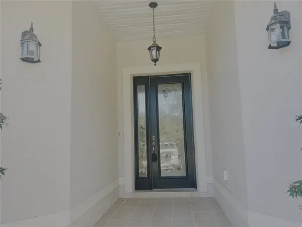 a view of a hallway with a door and a window